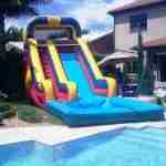 water slide next to a pool