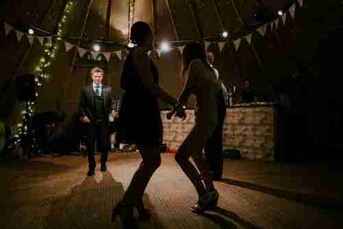 people dancing on a wood floor